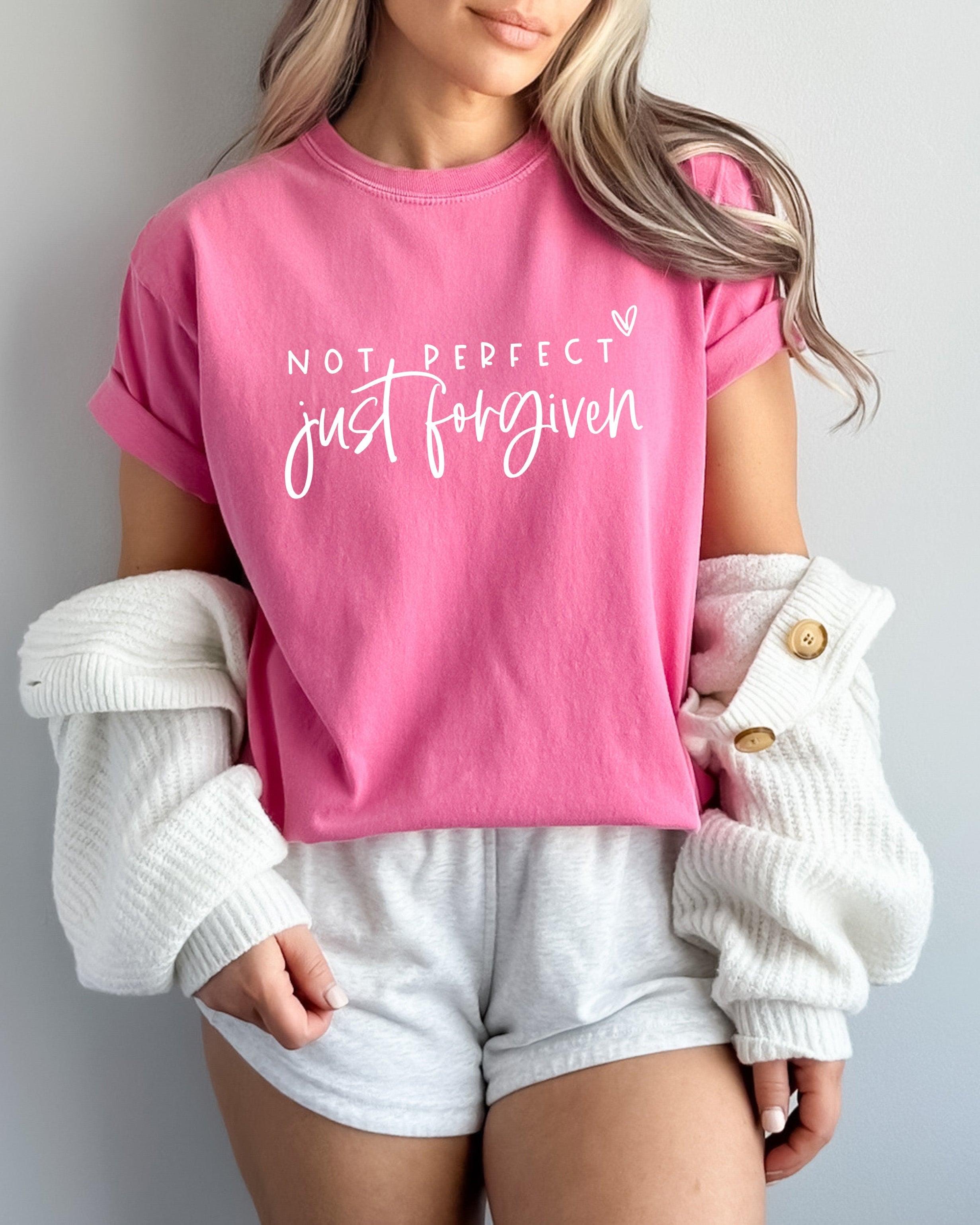 Pink unisex T-shirt with crew neck and 'Not perfect, just forgiven' script graphic