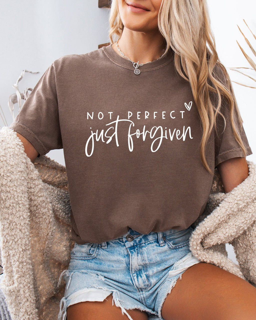 Brown unisex T-shirt with crew neck and 'Not perfect, just forgiven' script graphic