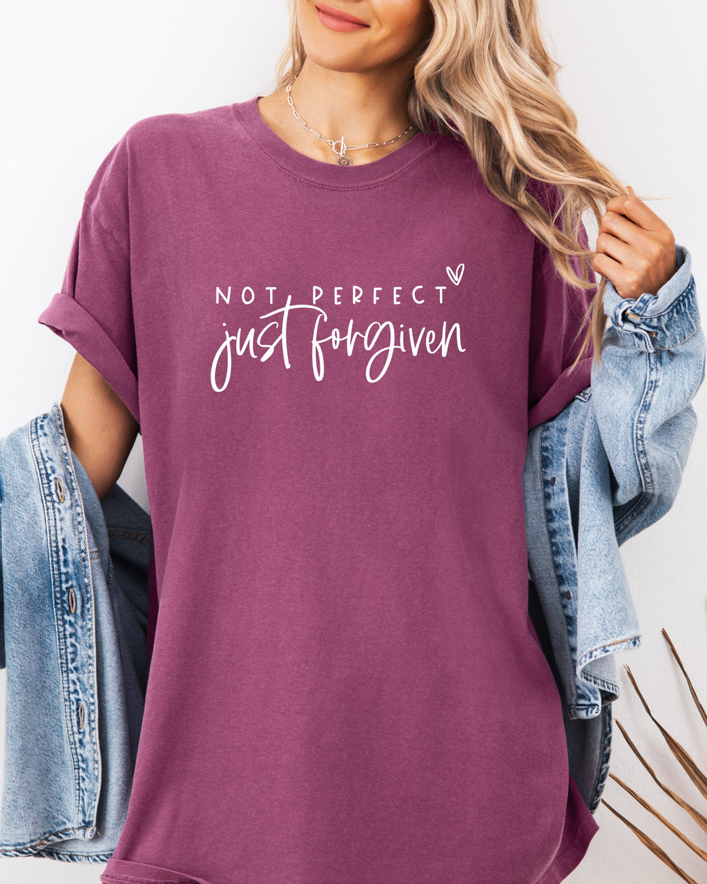Berry purple garment-dyed T-shirt with “Not perfect, just forgiven” graphic
