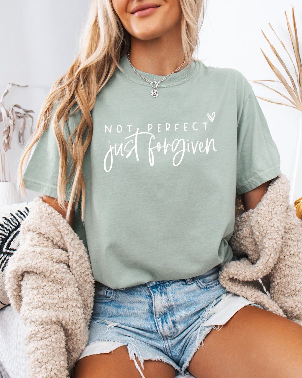 Green garment-dyed T-shirt with “Not perfect, just forgiven” graphic