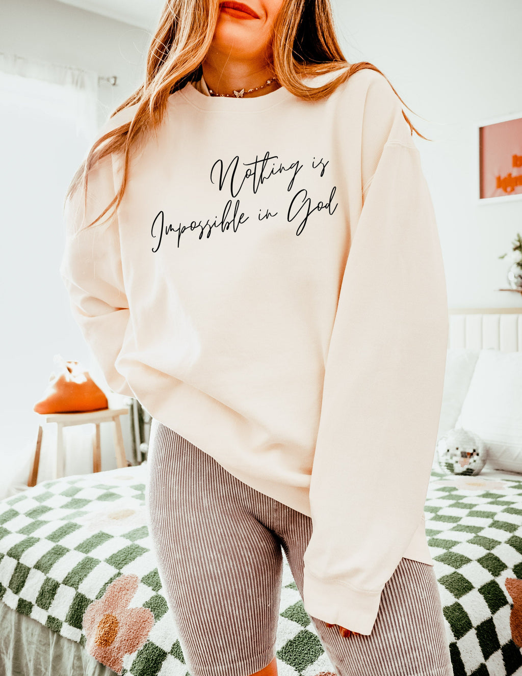 Cream crewneck sweatshirt with white inspirational front print and long sleeves
