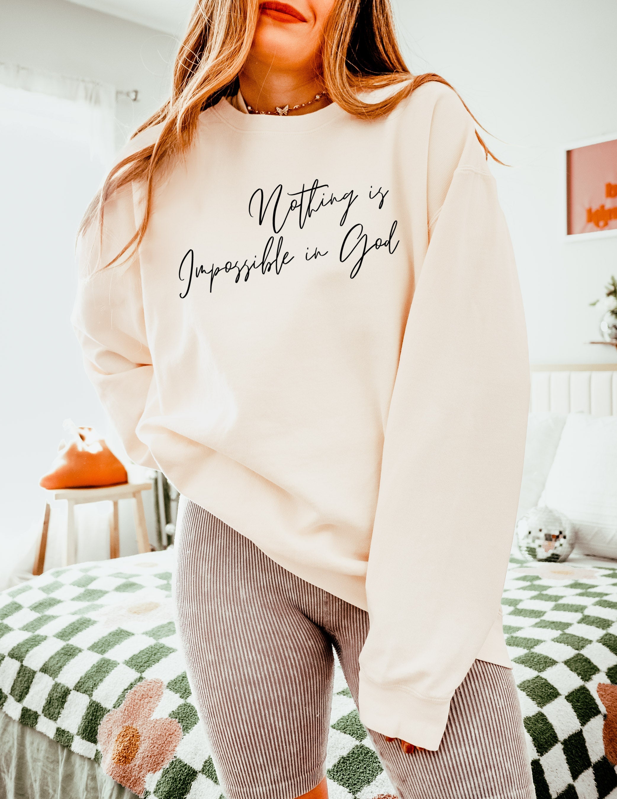 Cream crewneck sweatshirt with white inspirational front print and long sleeves