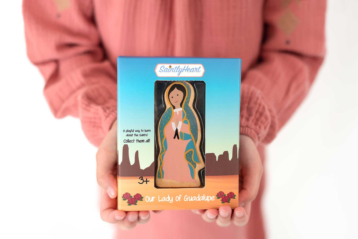 Guadalupe devotional card with illustrated Our Lady figure on blue cover and skyline