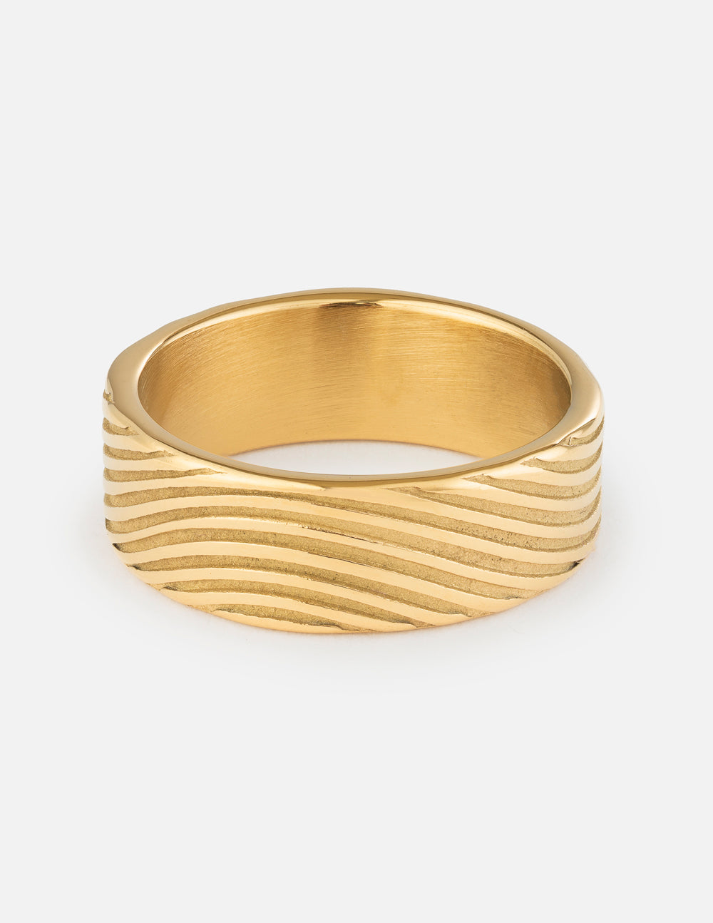 Gold tone ribbed band ring with curved grooves and smooth inner band