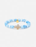 Light blue beaded cross bracelet with pale cross centerpiece and small gold charm