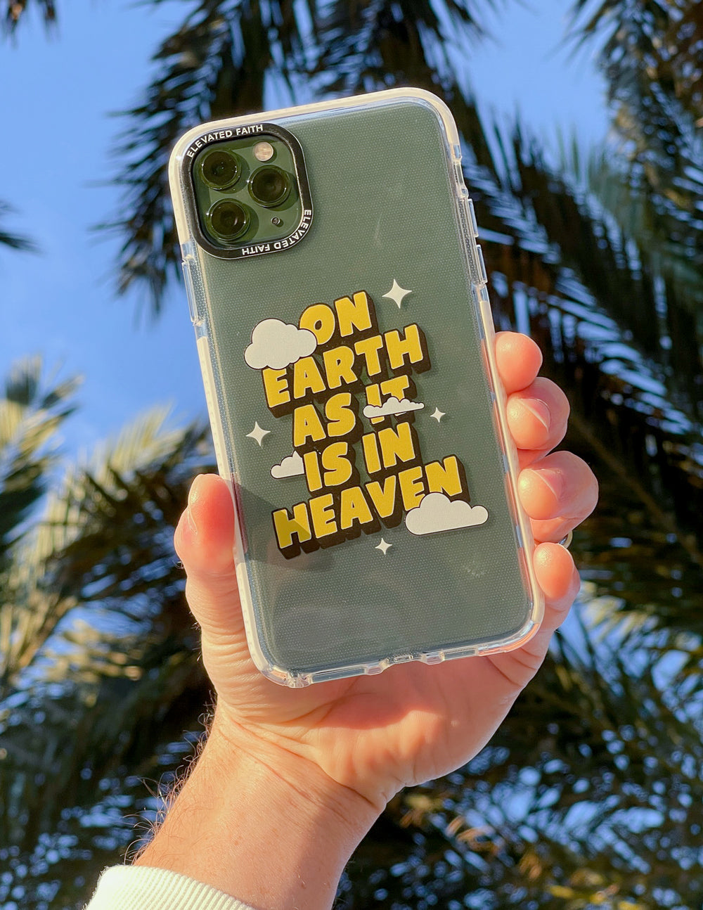 Transparent phone case with yellow text graphic and cloud icons on dark green