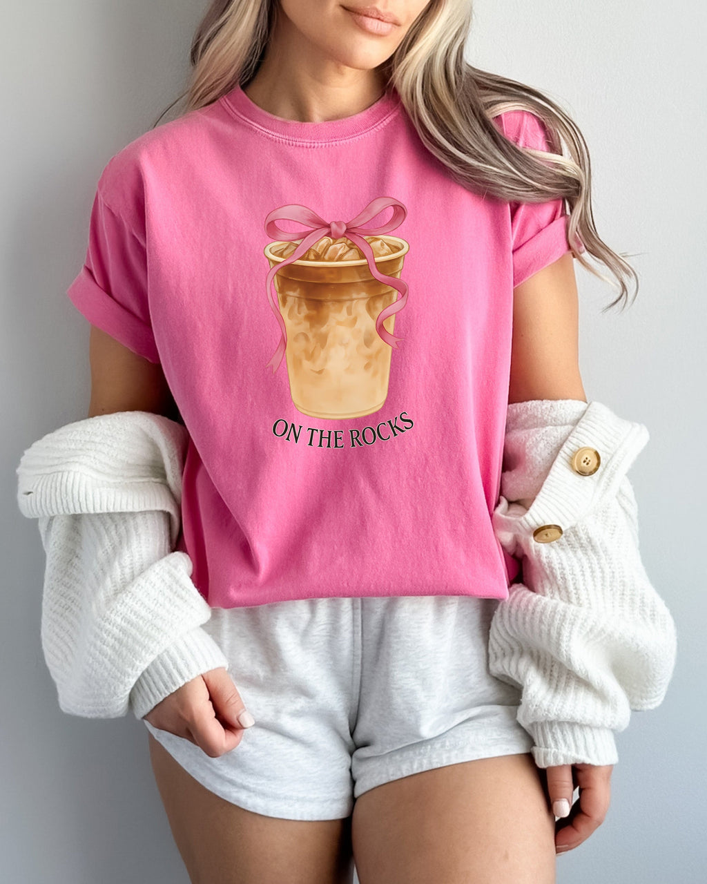 Pink T-shirt with iced latte cup graphic, pink ribbon bow, and "On the Rocks" print