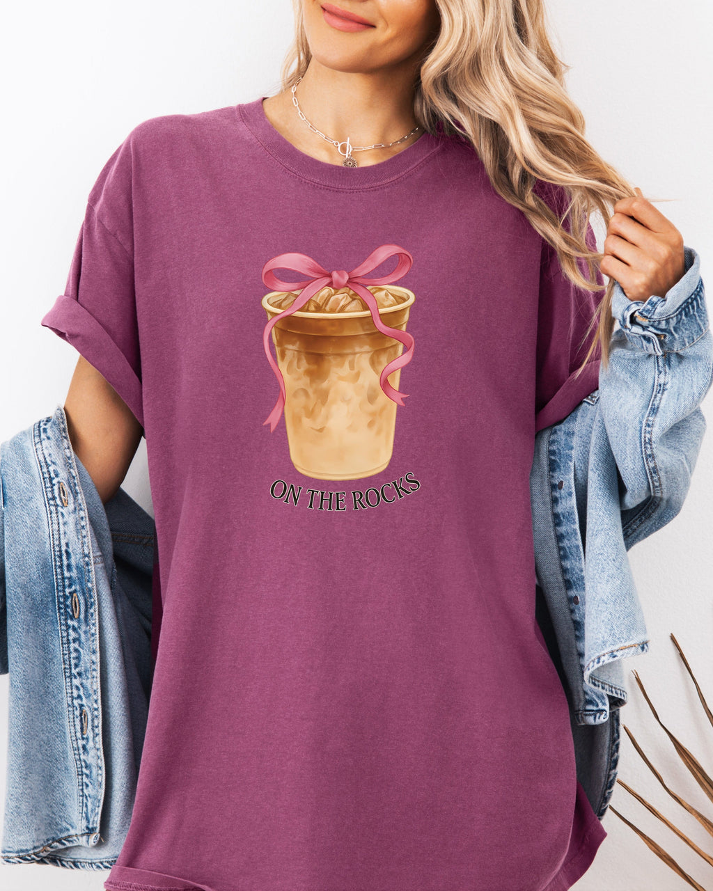 Berry purple iced latte graphic T-shirt with ribboned cup and “ON THE ROCKS”