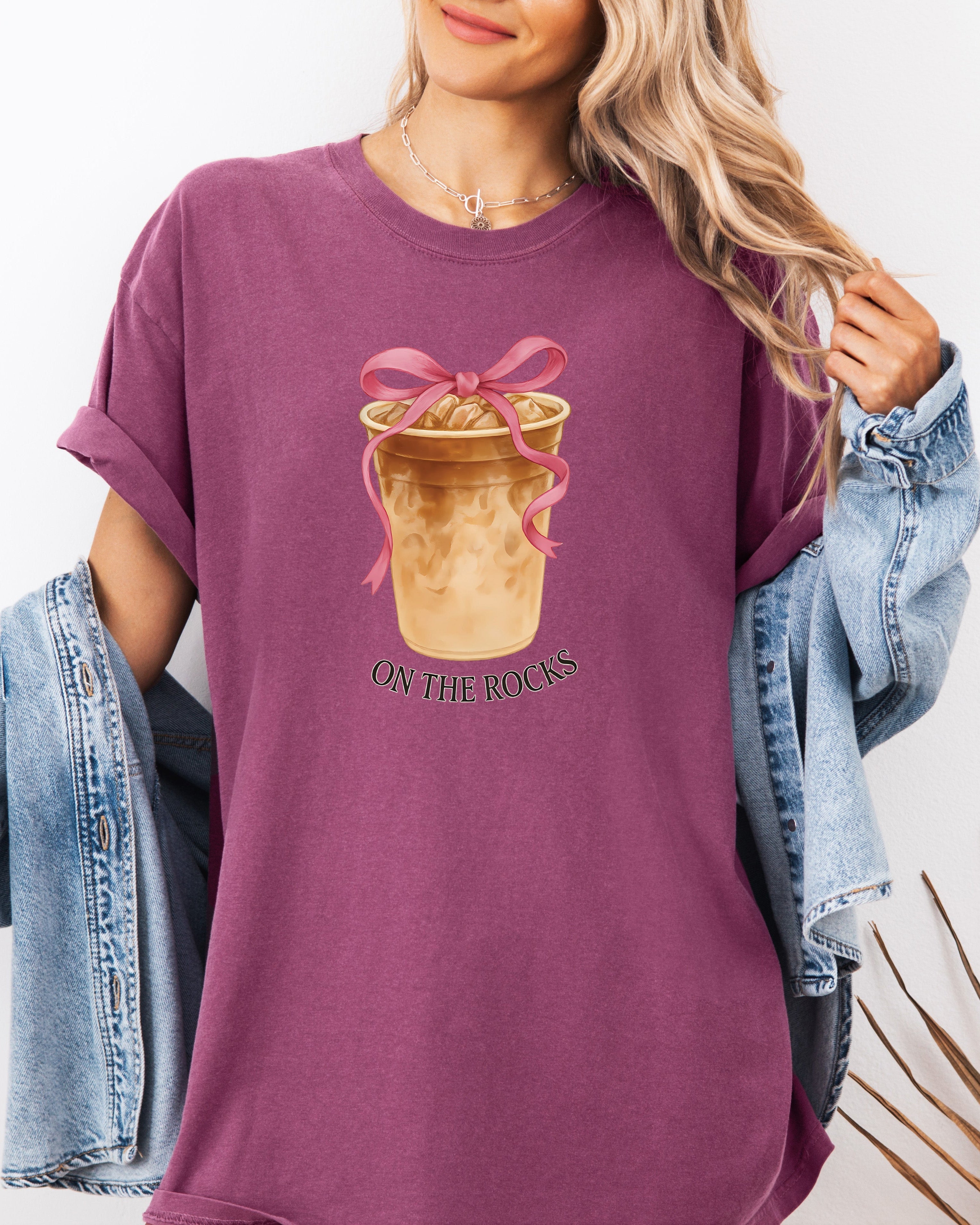 Berry purple iced latte graphic T-shirt with ribboned cup and “ON THE ROCKS”