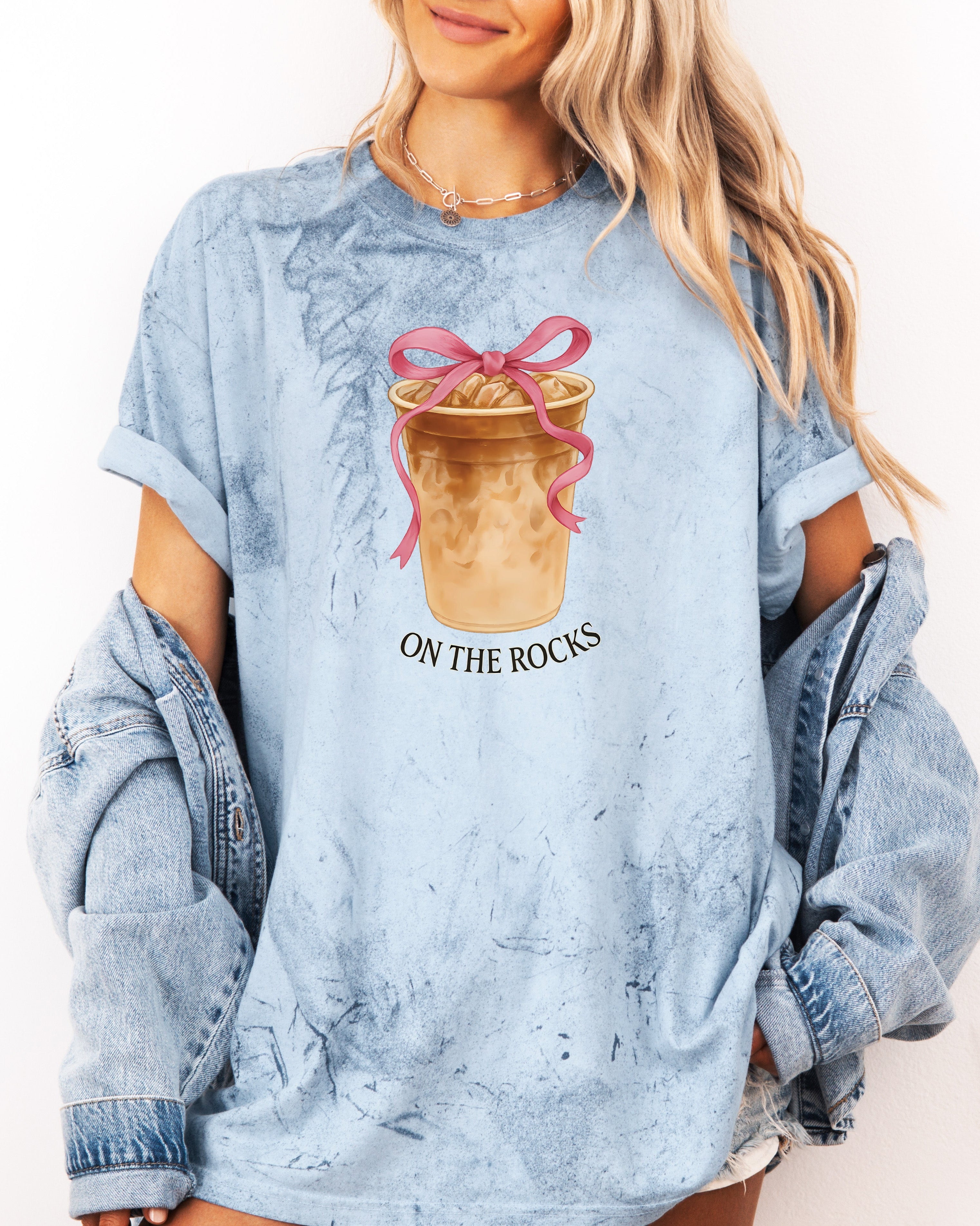 Light blue iced latte graphic T-shirt with ribboned cup and “ON THE ROCKS”