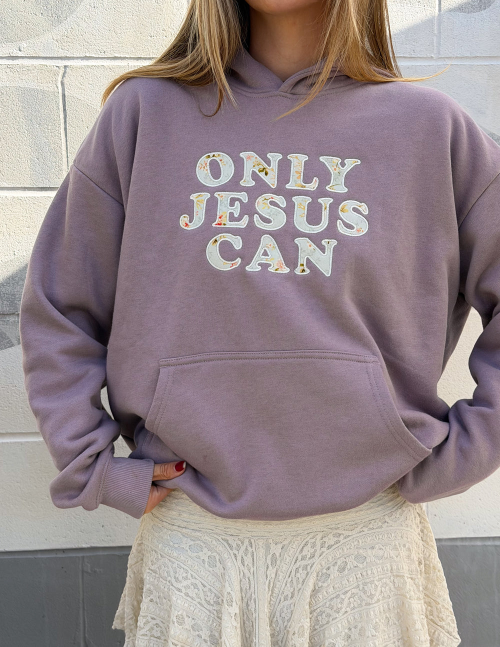Lilac unisex hoodie with hood, "ONLY JESUS CAN" print on the back