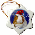Porcelain snowflake Christmas ornament with guinea pig in red Santa hat on blue background