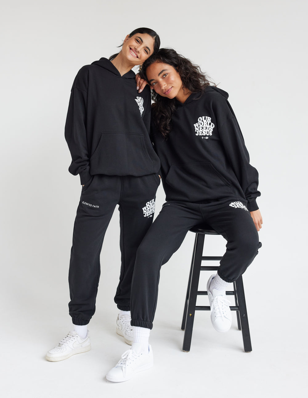 Black unisex sweatpants with Our World Needs Jesus logo and cuffed ankle