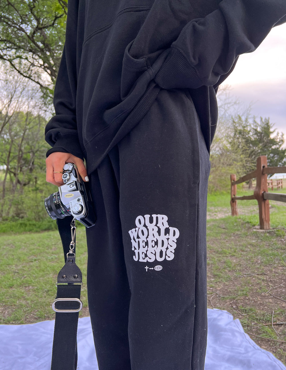 Black sweatpants with white side logo and elastic cuffs