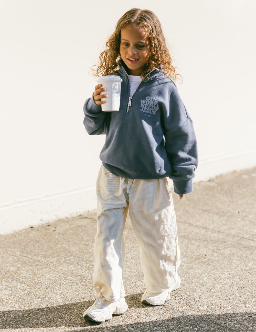 Kids half-zip sweatshirt in dark blue on child, long sleeves and front logo