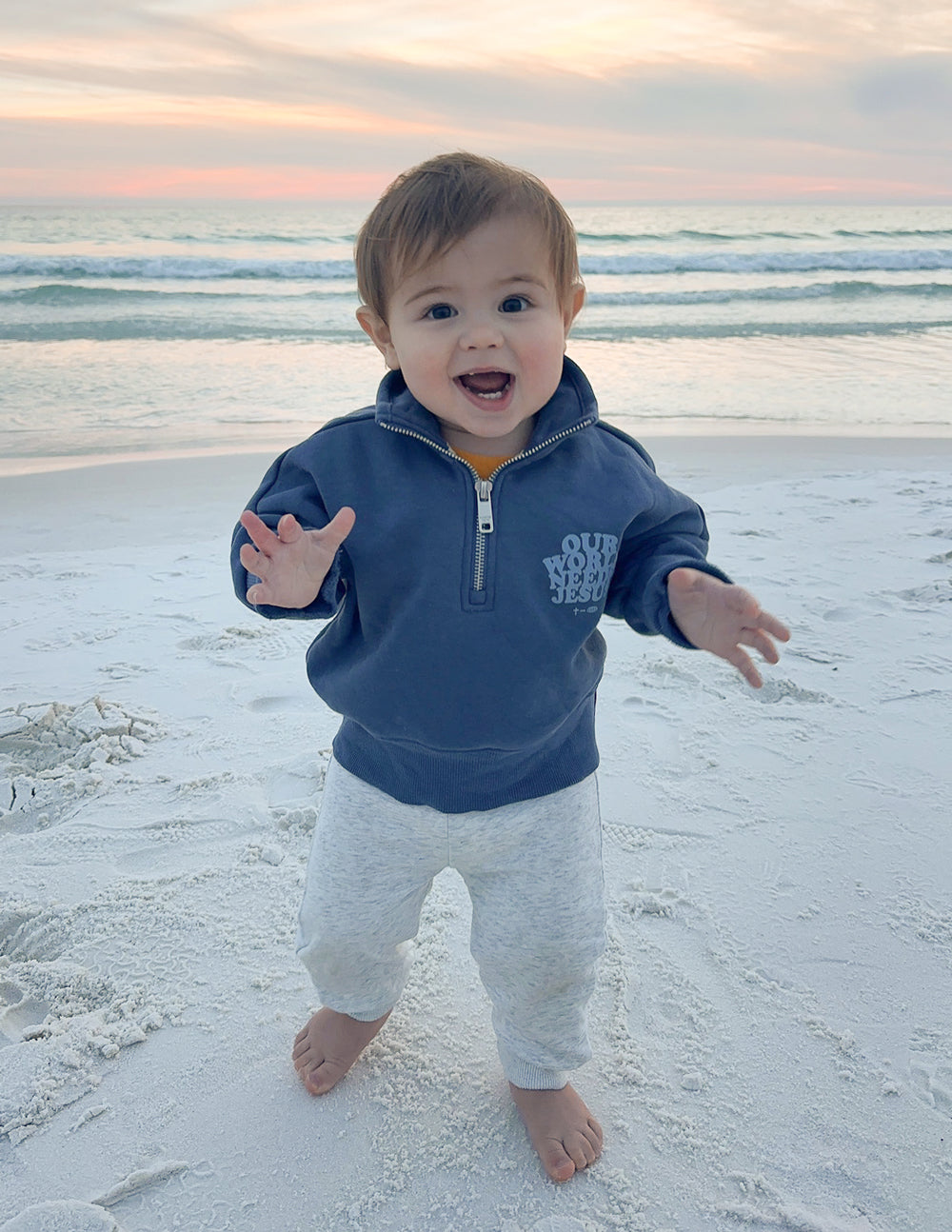Kids half-zip sweatshirt in dark blue with front logo, child looking forward