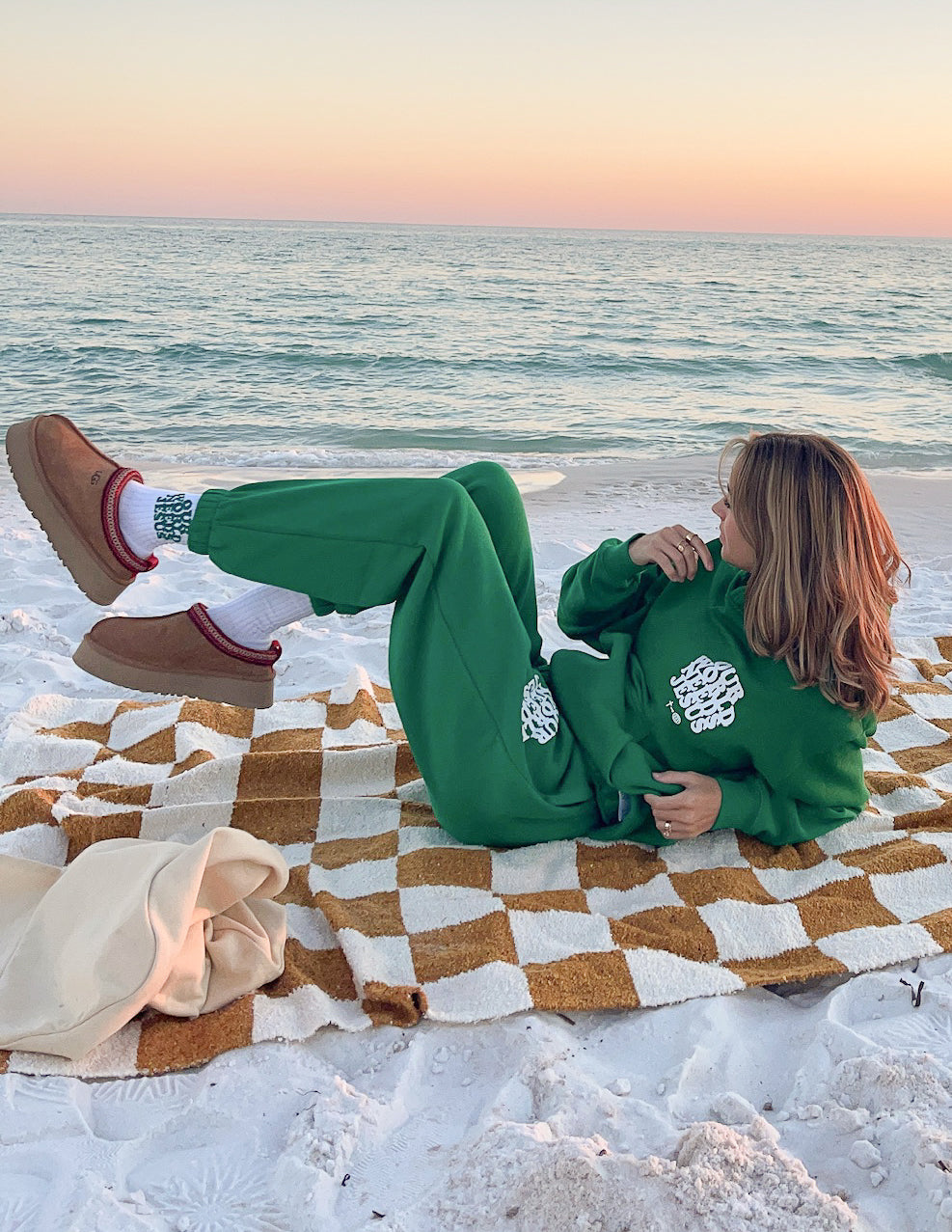Green unisex hoodie set: hoodie with white logo on sleeve and chest