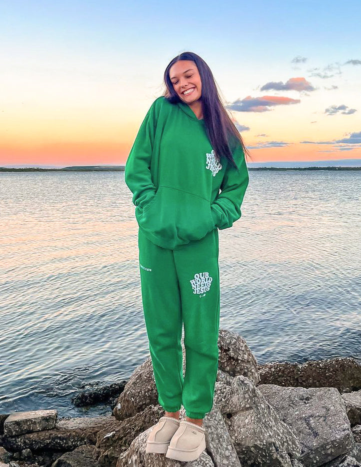 Green unisex sweatpants with side logo print and ankle cuffs