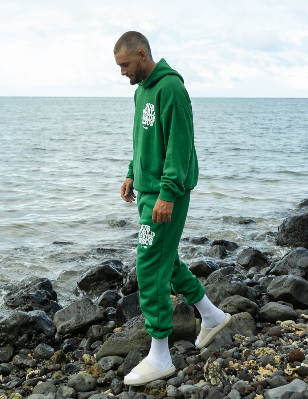Green unisex sweatpants with logo print on side seam and ankle cuffs