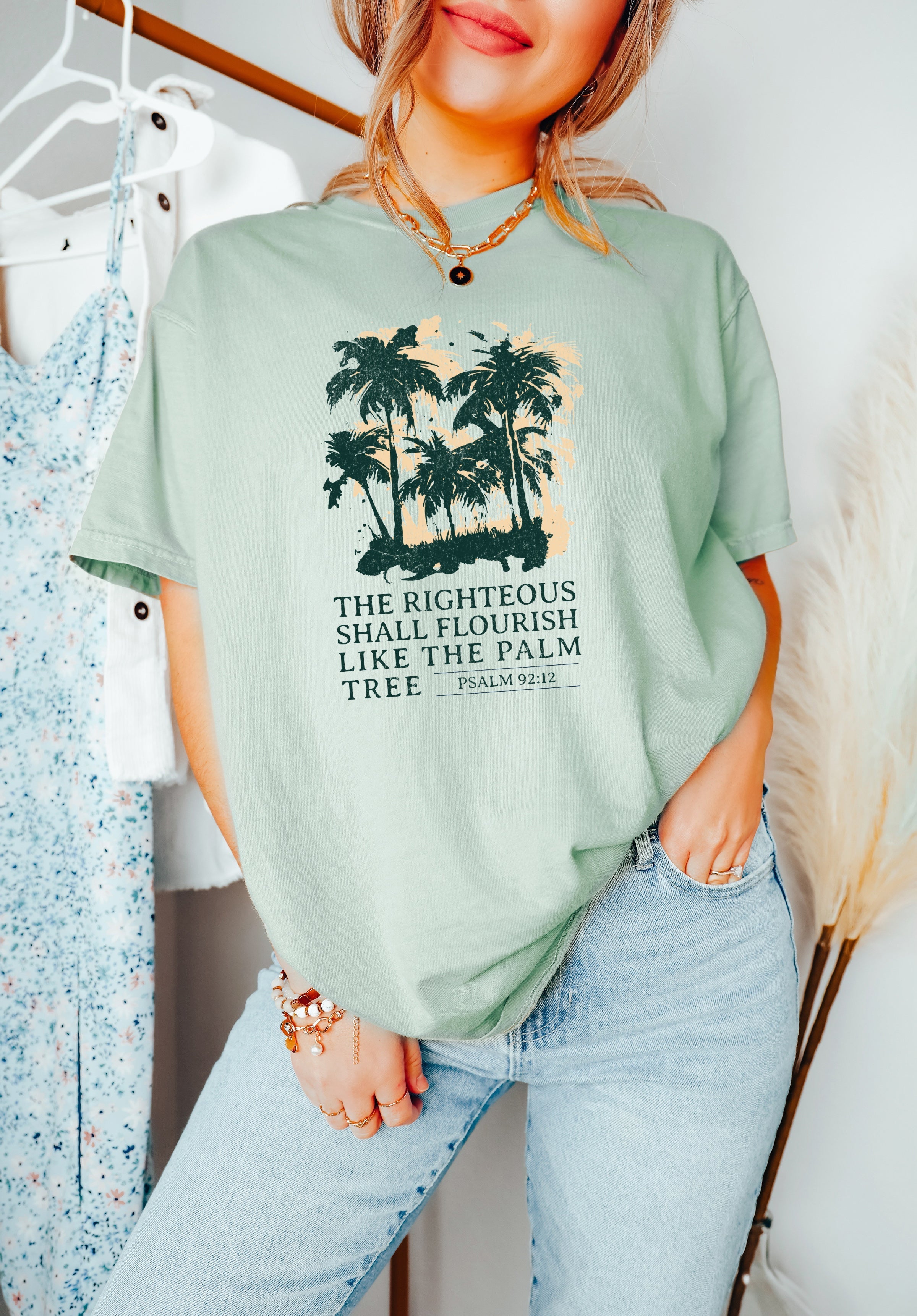 Light green T-shirt with dark green palm tree faith graphic and short sleeves