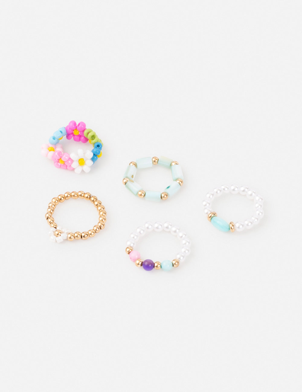 Pastel beaded ring set with stackable blue, pink, purple and yellow bead bands