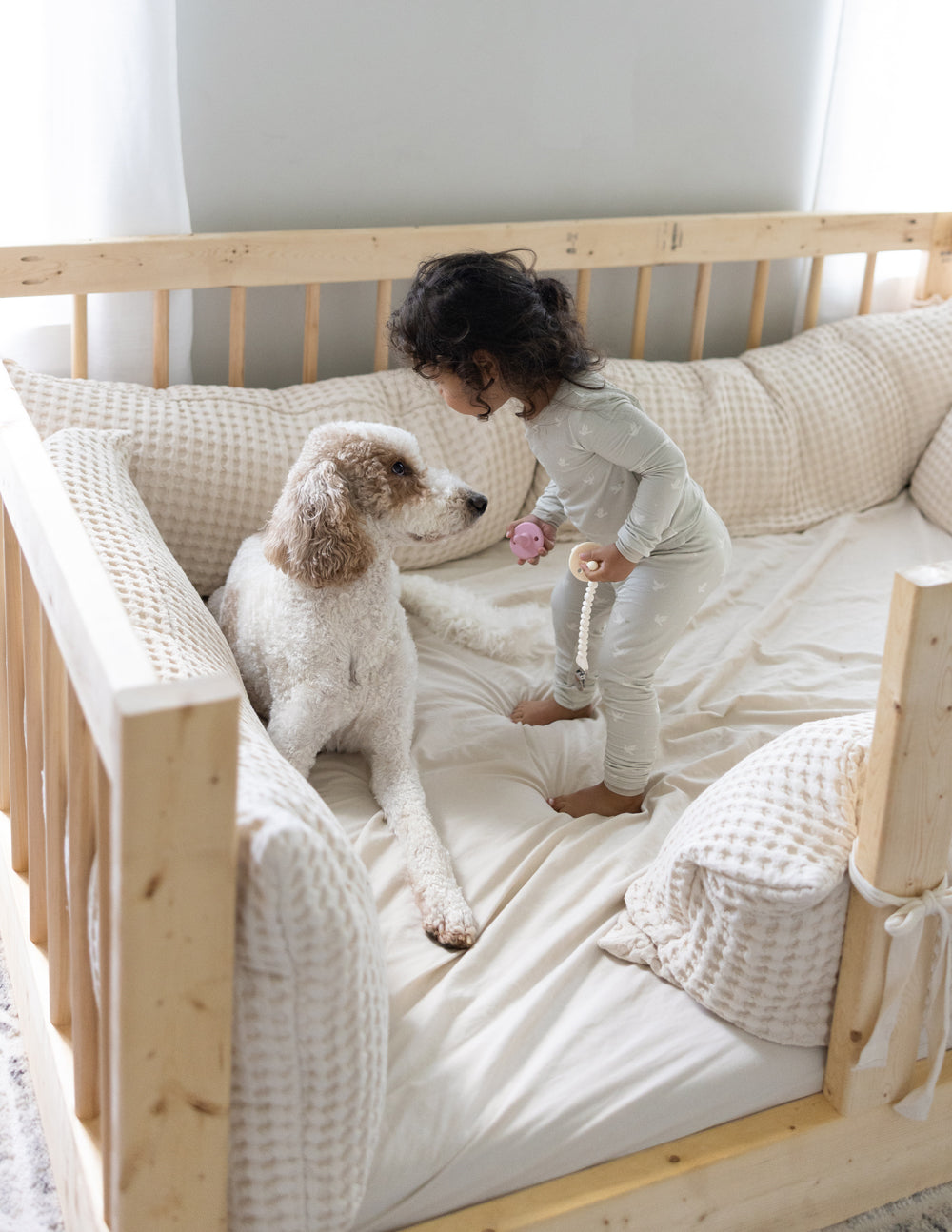 Kids bamboo pajama set on child: long-sleeve top and jogger pants in light cream