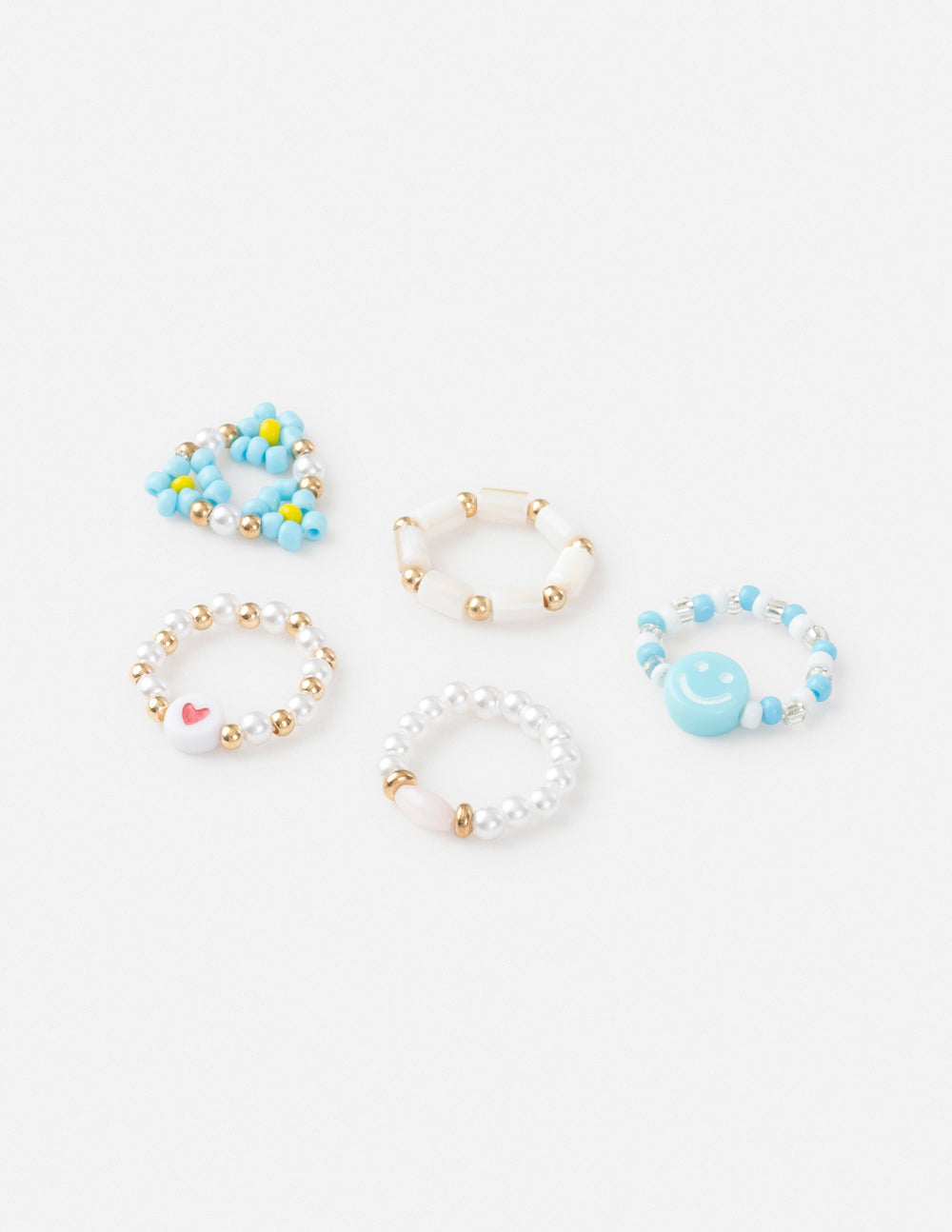 Beaded ring set with light blue and white beads on gold-tone bands