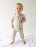 Bamboo footed onesie with front zipper, light cream color, long sleeves and legs