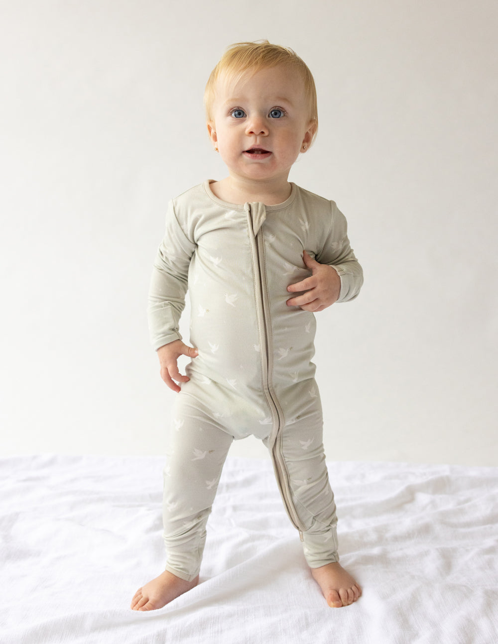 Bamboo footed onesie with front zipper, light cream color, long sleeves and legs