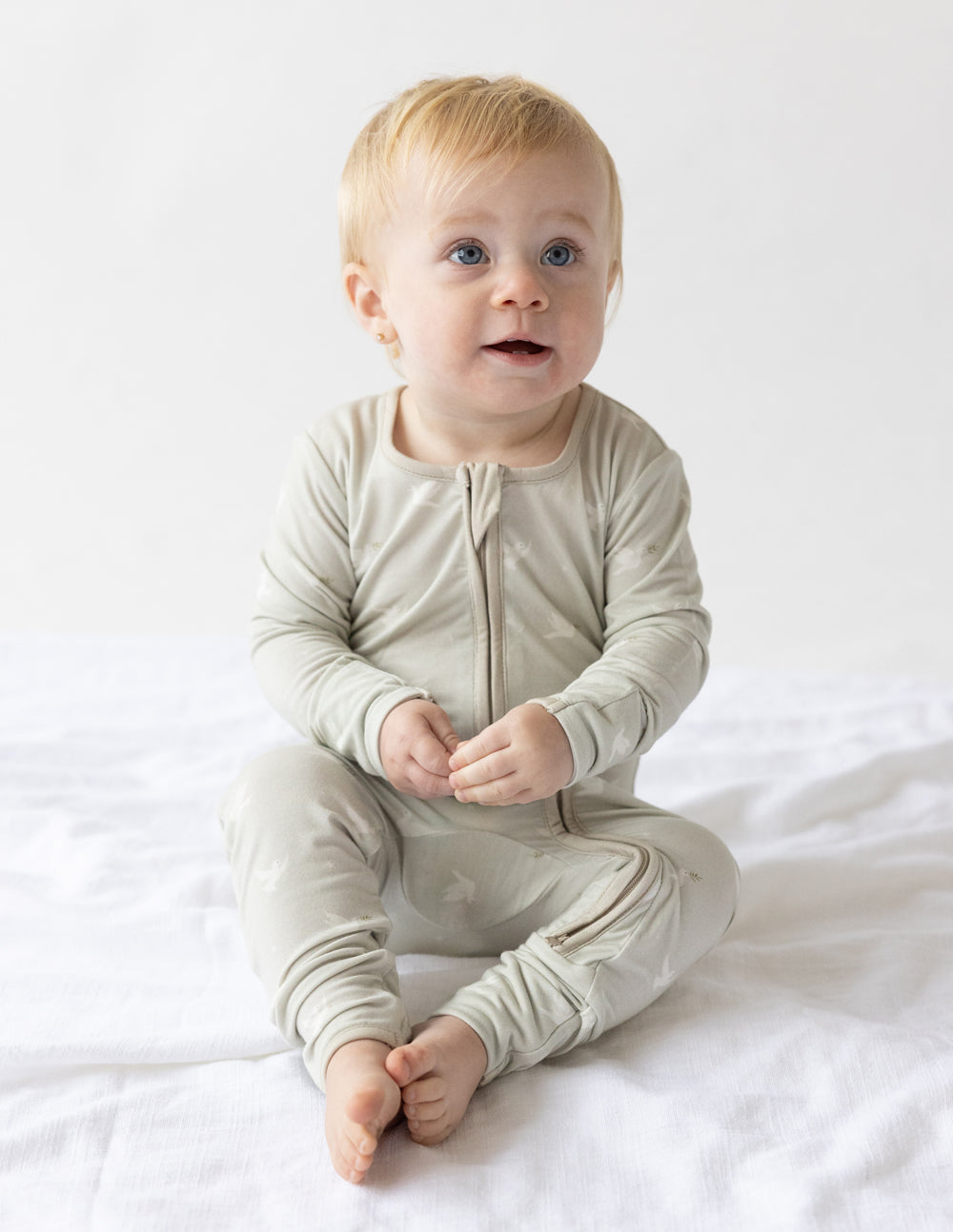 Bamboo footed onesie with front zipper, light cream, long sleeves and enclosed feet