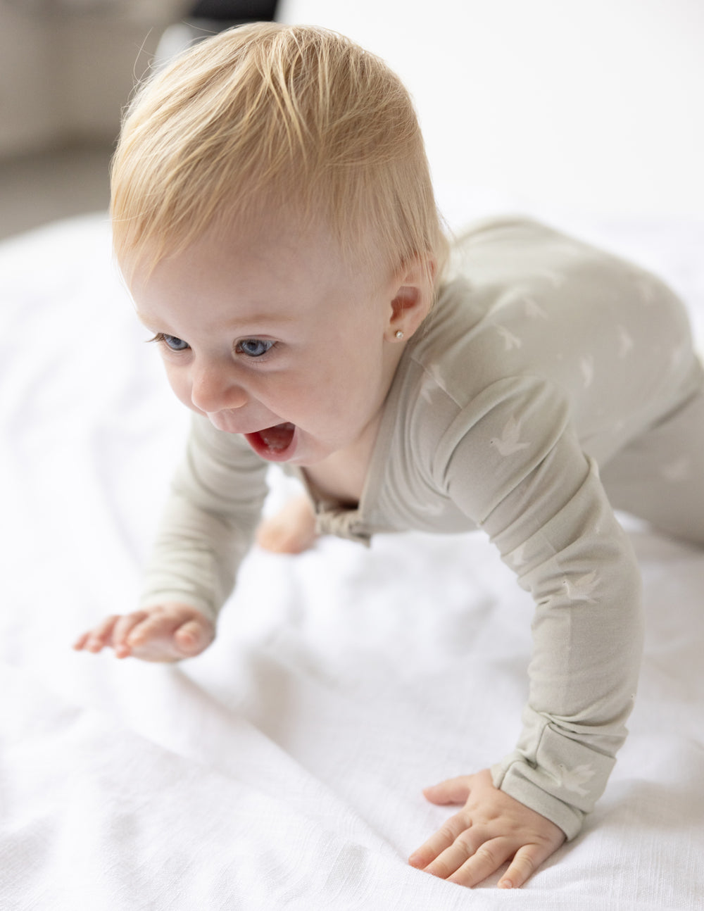 Bamboo footed onesie with front zipper, light cream, long sleeves and enclosed feet