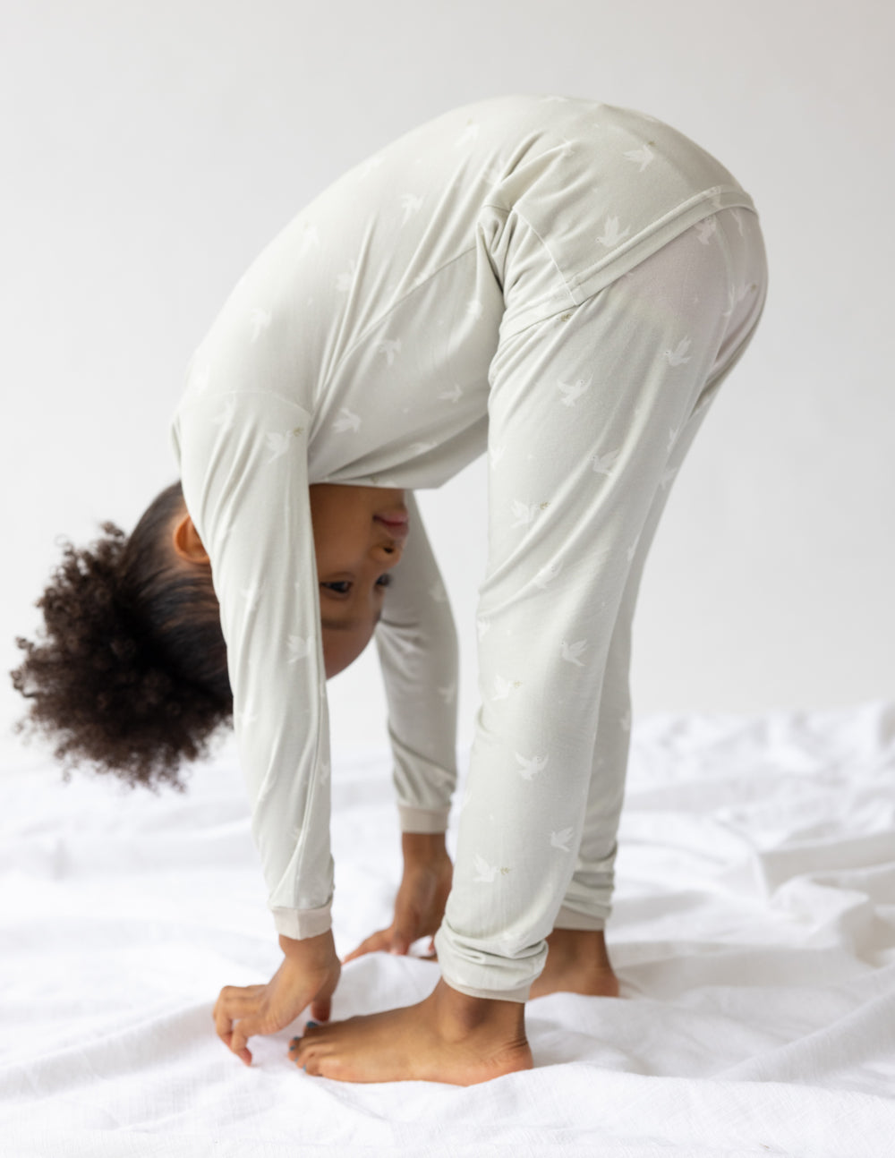 Kids bamboo pajama set, light cream long-sleeve top and jogger pants with small print