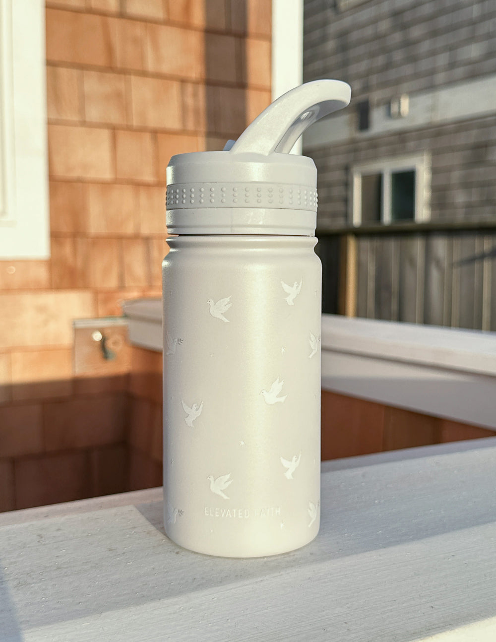 Kids water bottle in pale gray with bird pattern and flip straw lid