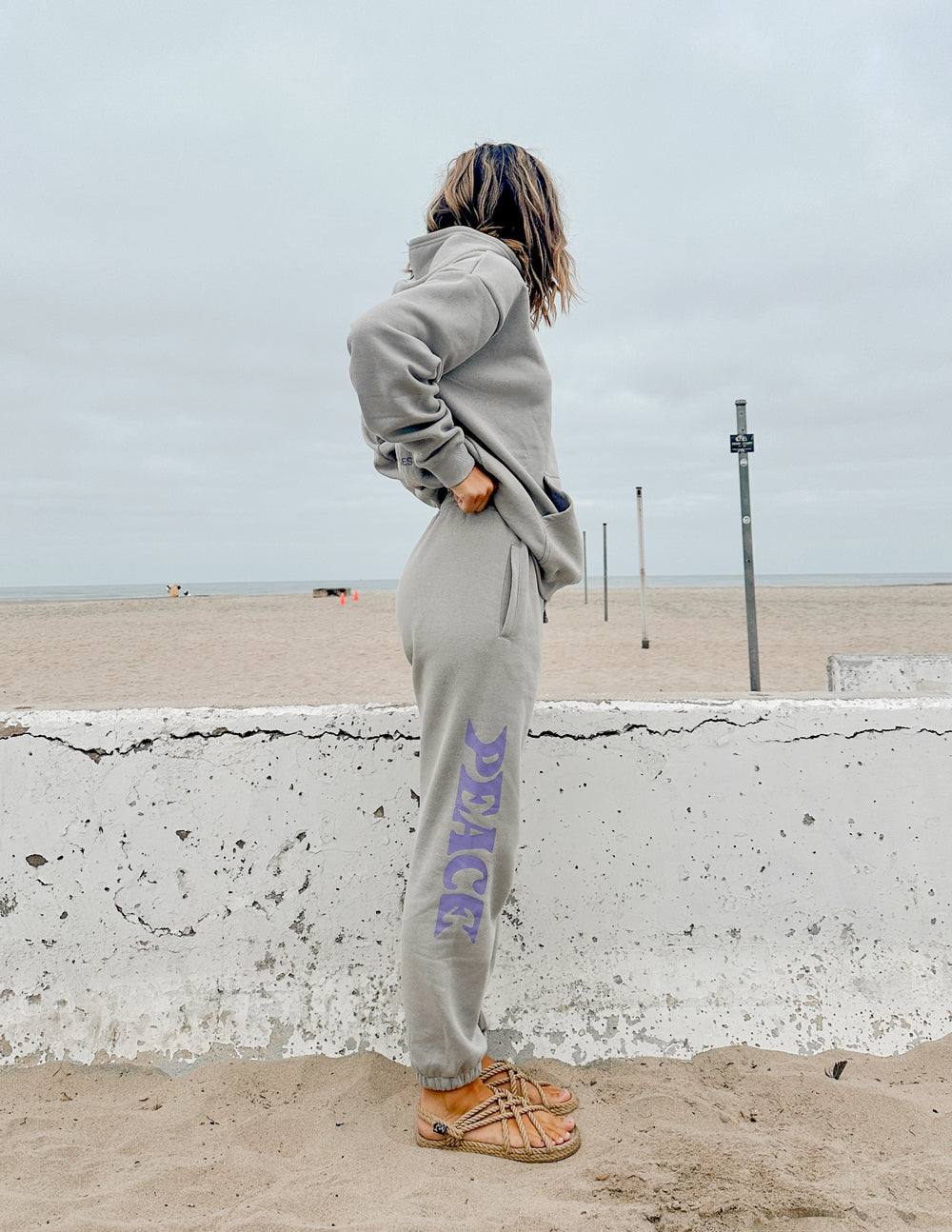 Unisex sweatpants, light gray with purple Peace logo print, side view