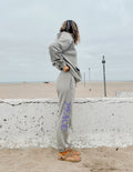 Unisex sweatpants, light gray with purple Peace logo print, side view