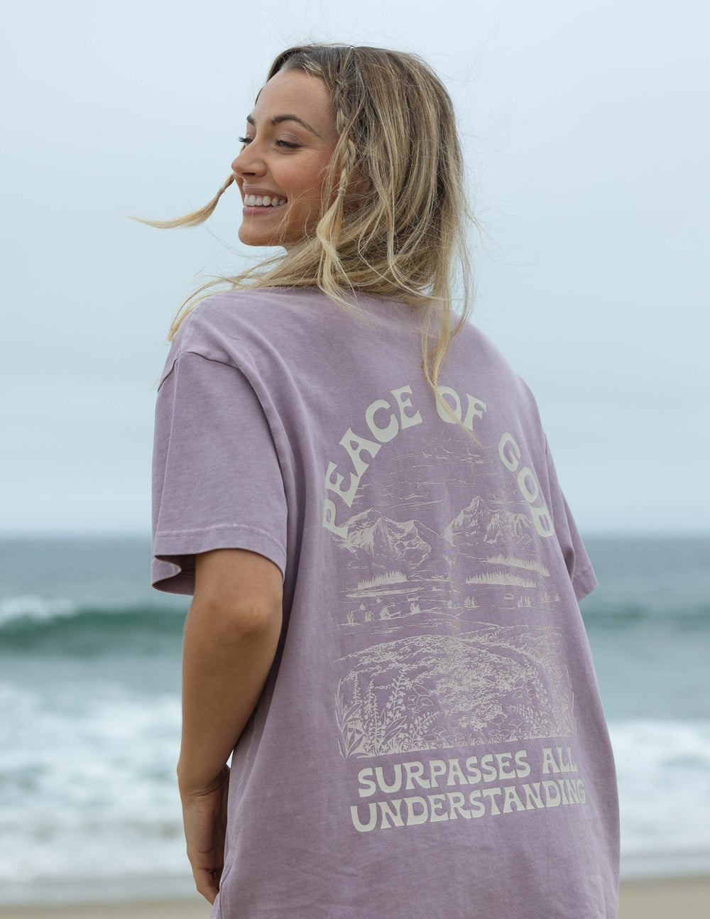 Lavender unisex T-shirt with back graphic text "Peace of God" and landscape print