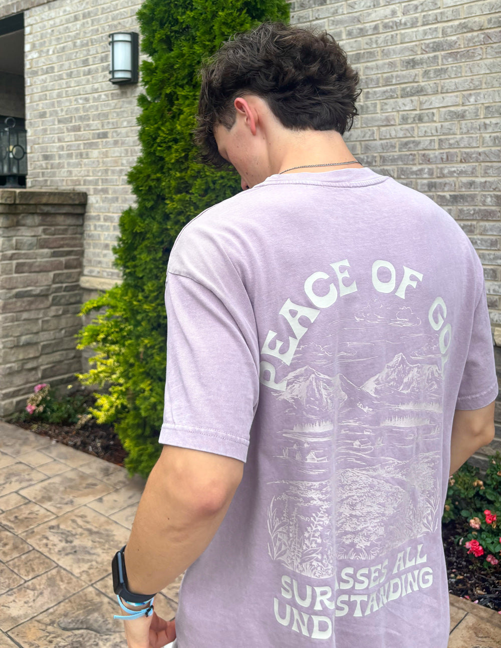 Lavender unisex T-shirt back view with large "Peace of God" graphic and text