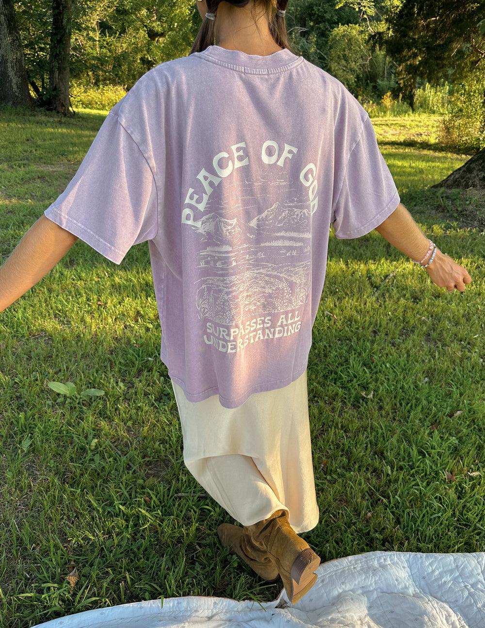 Lavender unisex T-shirt back view with large "Peace of God" graphic