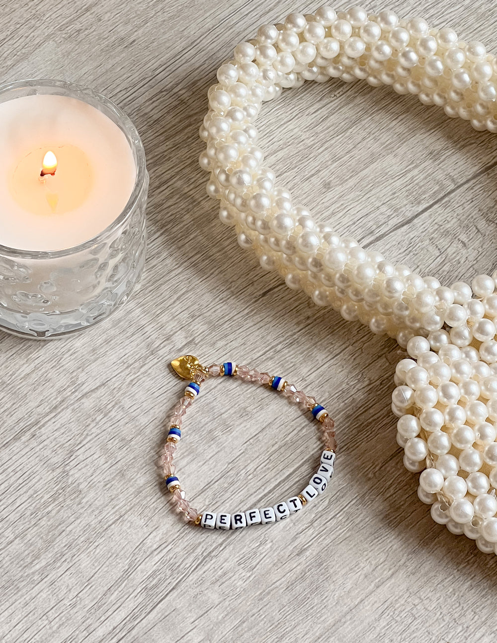 Beaded heart bracelet with pink beads, blue accents, and PerfectLove letter beads