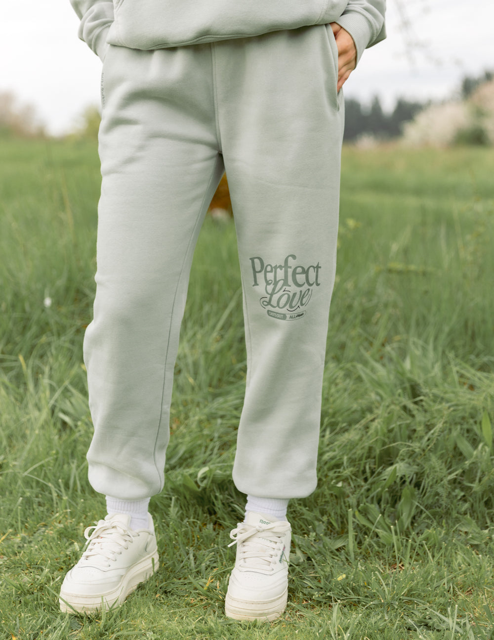 Mint unisex sweatpants with “Perfect Love” print and tapered jogger cuffs