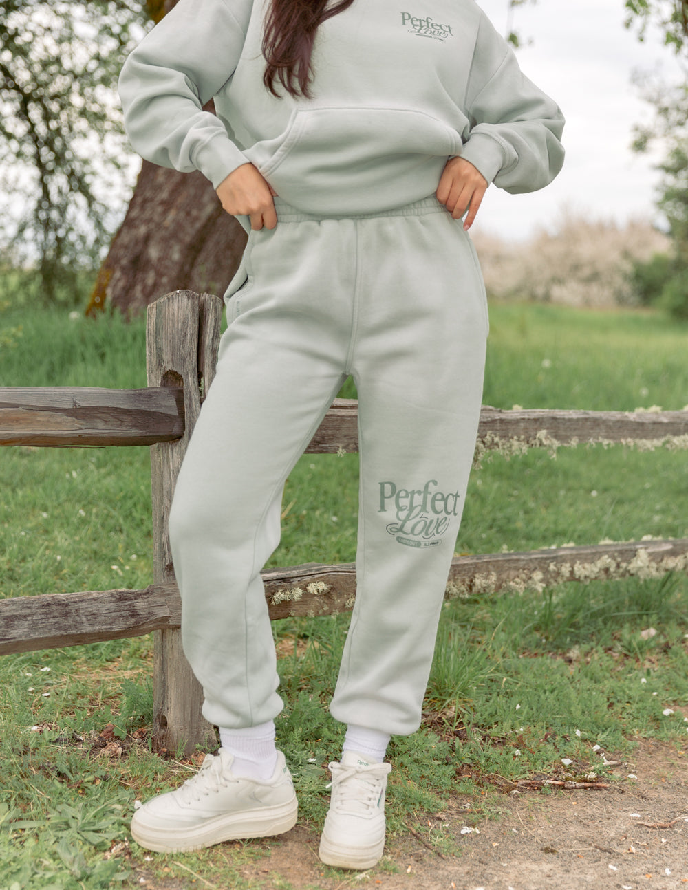 Mint unisex sweatpants with elastic cuffs and “Perfect Love” graphic on leg
