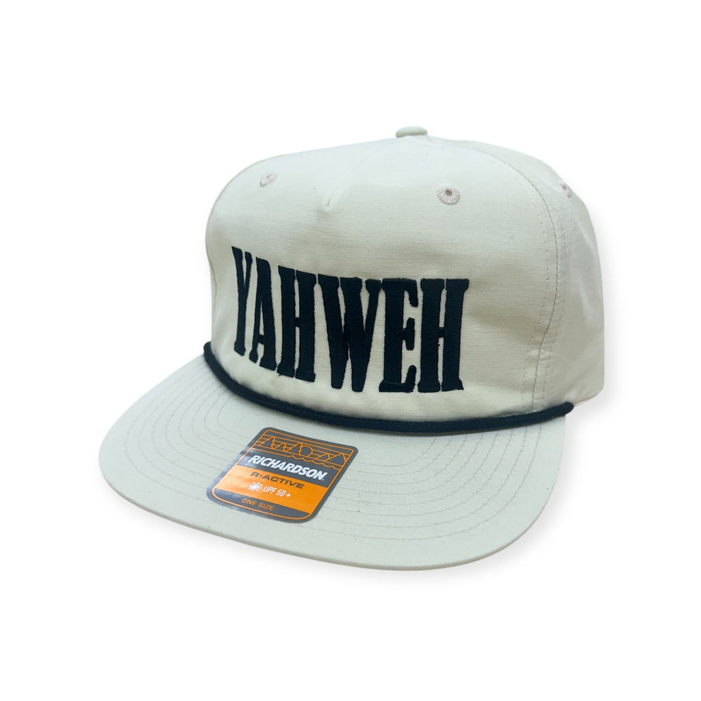 White snapback cap with navy YAHWEH embroidery and Richardson logo patch
