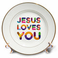 White porcelain plate with colorful 'JESUS LOVES YOU' text and thin gold rim