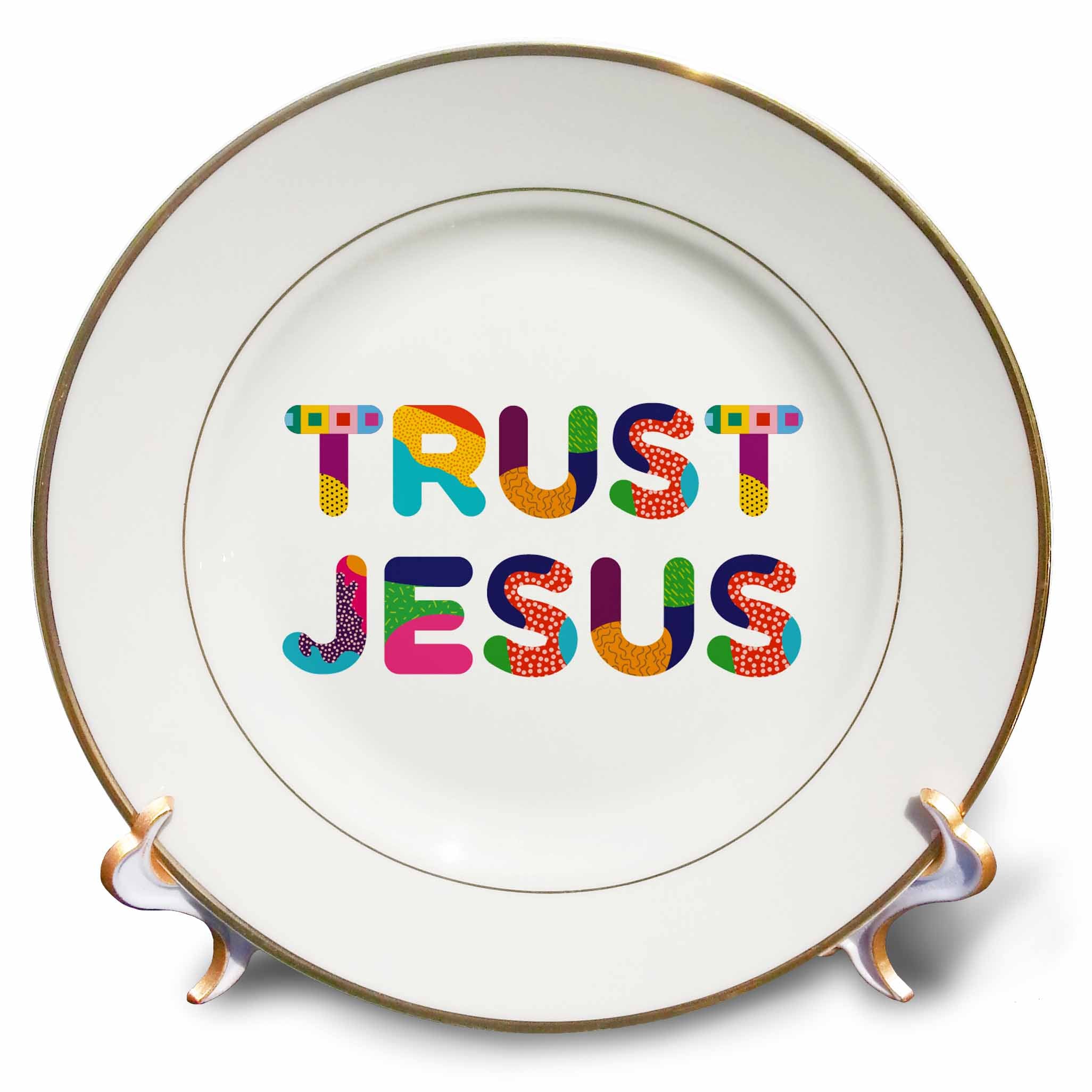 Porcelain plate with gold rim and colorful typography reading “TRUST JESUS”