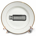 Porcelain plate with gold rim and black USB graphic reading 'JESUS SAVES'