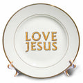 Porcelain plate, white background with yellow 'LOVE JESUS' text, gold rim