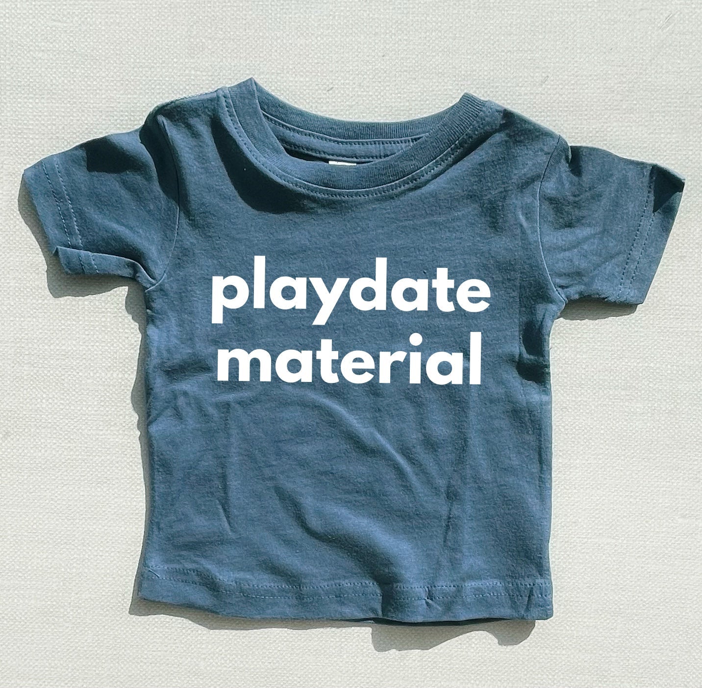 Blue baby and toddler t-shirt with “playdate material” front print