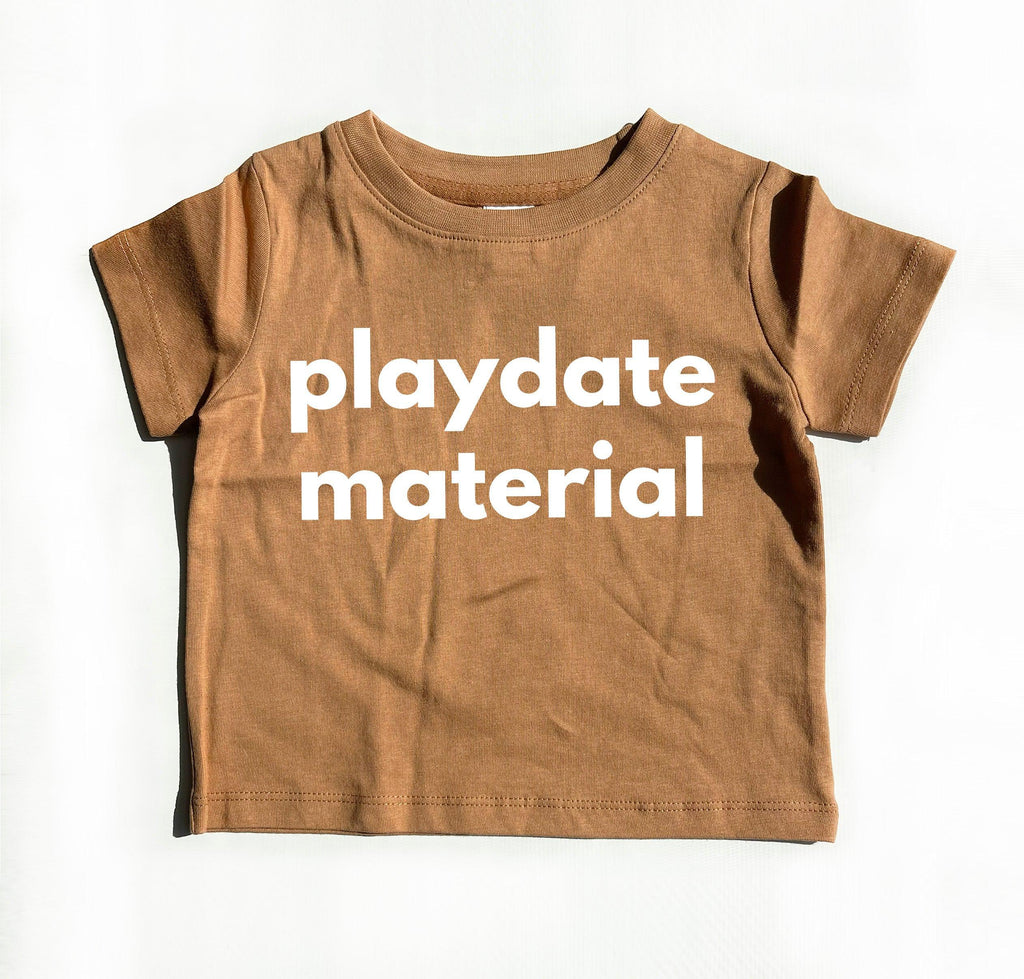 Organic cotton baby tee in ginger brown with front text graphic
