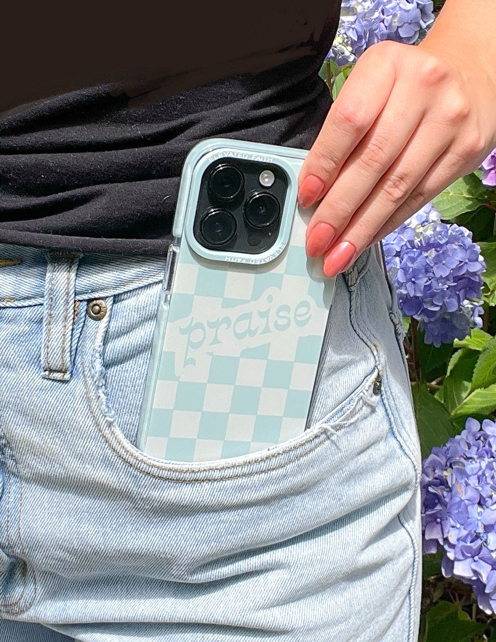 Light blue checkered phone case with camera cutouts and 'praise' text
