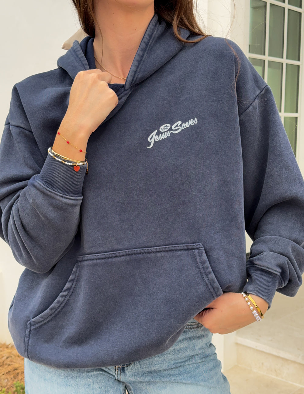 Dark navy unisex hoodie with kangaroo pocket and chest “Jesus Saves” logo